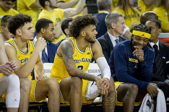 Adrien Nunez (5), Isaiah Livers (2), and Zavier Simpson (3)