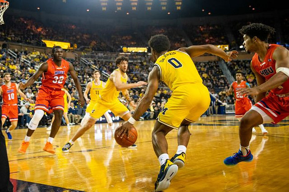 Colin Castleton (11), Brandon Johns Jr. (23), and David DeJulius (0)