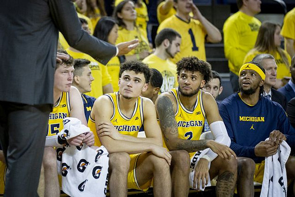 Jon Teske (15), Adrien Nunez (5), Isaiah Livers (2), and Zavier Simpson (3)