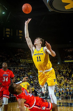 Colin Castleton (11) and Zavier Simpson (3)