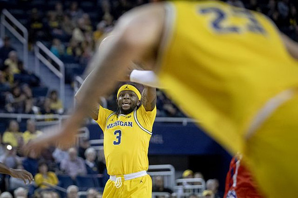 Zavier Simpson (3) and Brandon Johns Jr. (23)