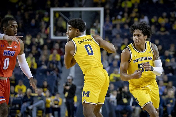 David DeJulius (0) and Eli Brooks (55)