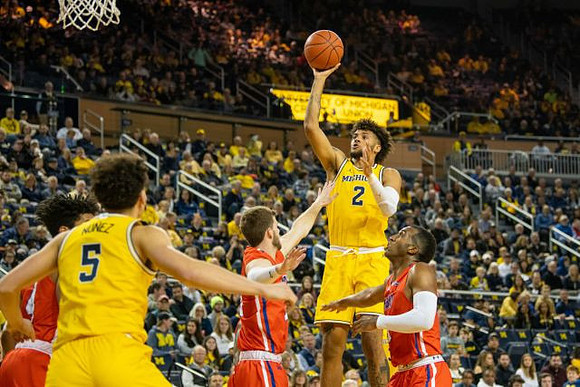 Adrien Nunez (5) and Isaiah Livers (2)