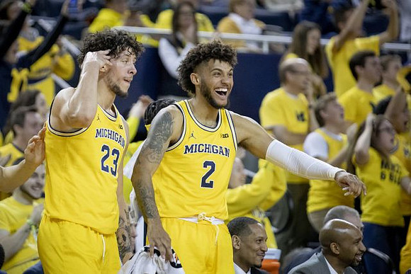Brandon Johns Jr. (23) and Isaiah Livers (2)