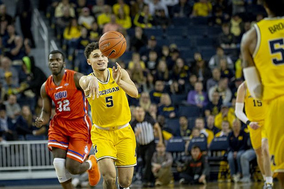 Adrien Nunez (5), Jon Teske (15), and Eli Brooks (55)