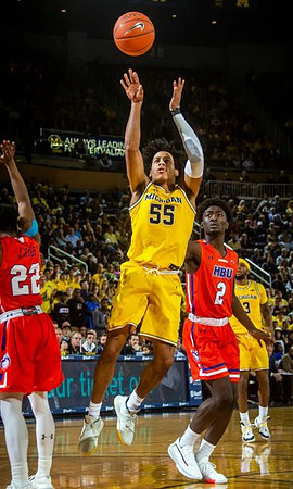 Eli Brooks (55) and Zavier Simpson (3)