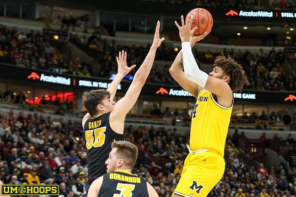 Eli Brooks (55) and Jon Teske (15)