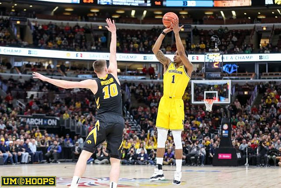Ignas Brazdeikis (13) and Zavier Simpson (3)