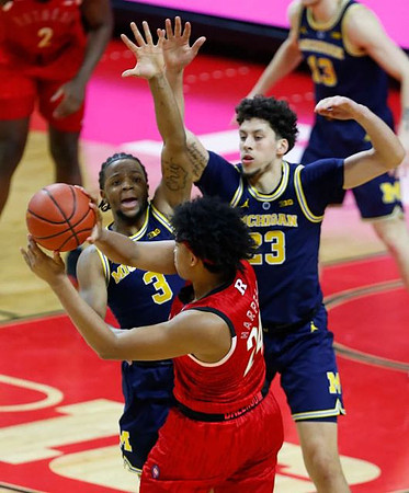 Zavier Simpson (3), Brandon Johns Jr. (23), and Ignas Brazdeikis (13)