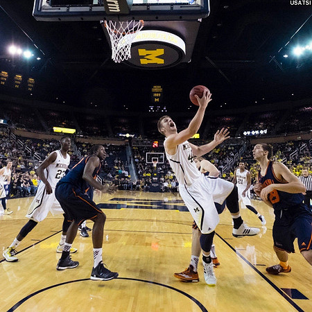 Caris LeVert (23), Max Bielfeldt (44), and Zak Irvin (21)