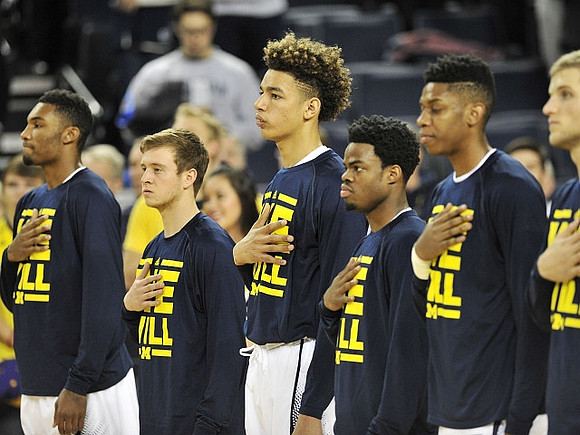 Zak Irvin (21), Spike Albrecht (2), D.J. Wilson (5), Derrick Walton Jr. (10), Kameron Chatman (3), and Max Bielfeldt (44)