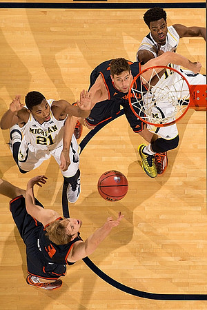 Zak Irvin (21) and Derrick Walton Jr. (10)