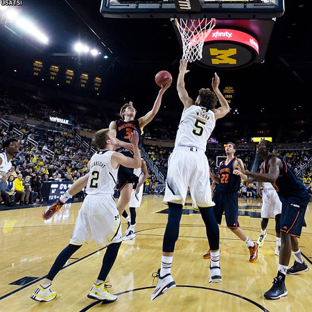 Spike Albrecht (2) and D.J. Wilson (5)