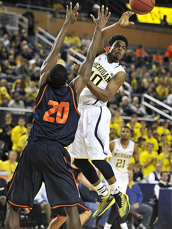 Derrick Walton Jr. (10) and Zak Irvin (21)