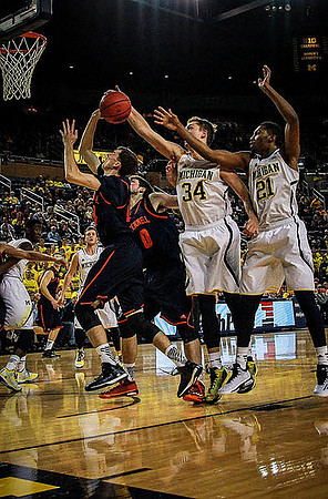 Spike Albrecht (2), Mark Donnal (34), and Zak Irvin (21)