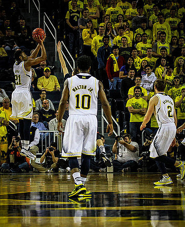 Zak Irvin (21), Derrick Walton Jr. (10), and Spike Albrecht (2)
