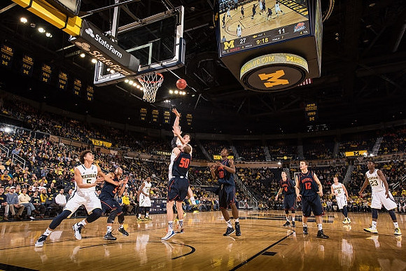 D.J. Wilson (5), Spike Albrecht (2), and Caris LeVert (23)