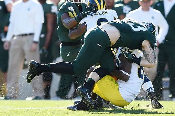 Raymon Taylor (6) and Amara Darboh (82)