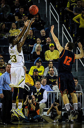 Caris LeVert (23) and Bucknell Head Coach Dave Paulsen
