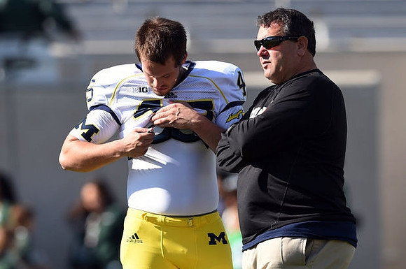 Matt Wile (45) and Brady Hoke