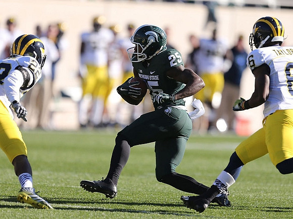 Jarrod Wilson (22) and Raymon Taylor (6)