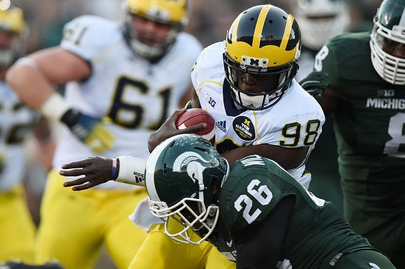 Graham Glasgow (61) and Devin Gardner (98)