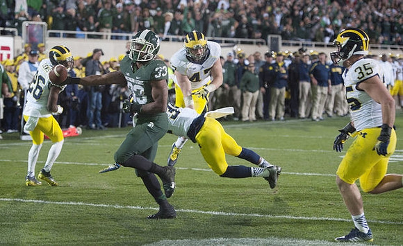 Jourdan Lewis (26), Jake Ryan (47), and Joe Bolden (35)