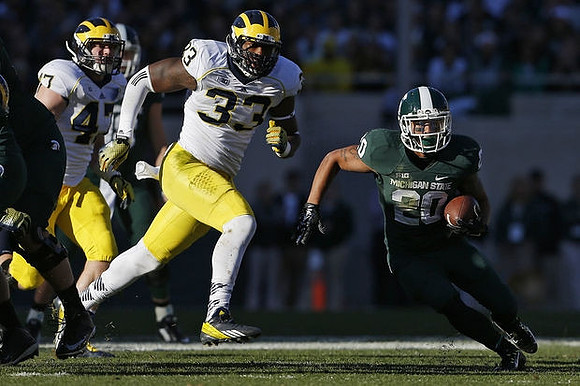 Mason Cole (52) and Taco Charlton (33)