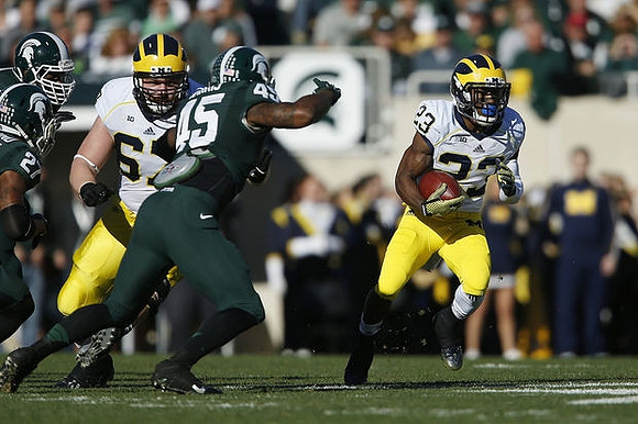 Kyle Kalis (67) and Dennis Norfleet (23)