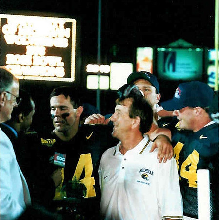 Brian Griese (14), Lloyd Carr, Rob Swett (44), and Jon Jansen (77)