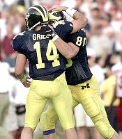 Jerame Tuman (80) and Brian Griese (14)