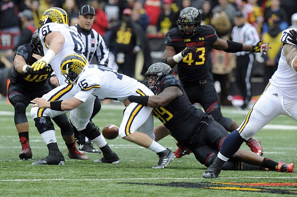 Graham Glasgow (61) and Jake Rudock (15)