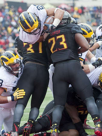 Erik Magnuson (78) and Drake Johnson (20)