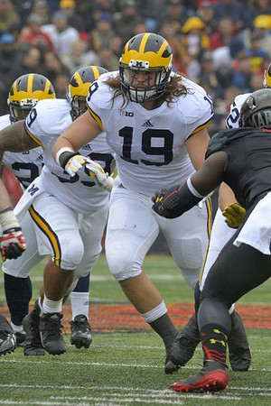 Henry Poggi (19), Sione Houma (39), and Mason Cole (52)