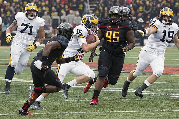Ben Braden (71), Jake Rudock (15), and Henry Poggi (19)