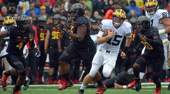 Jake Rudock (15) and Graham Glasgow (61)