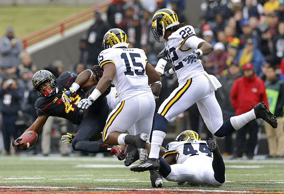 James Ross (15), Jarrod Wilson (22), and Delano Hill (44)