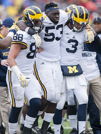 Jake Butt (88), Mario Ojemudia (53), and Wilton Speight (3)