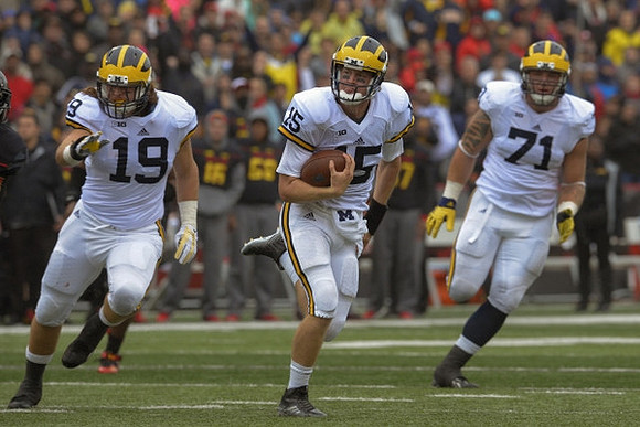 Henry Poggi (19), Jake Rudock (15), and Ben Braden (71)