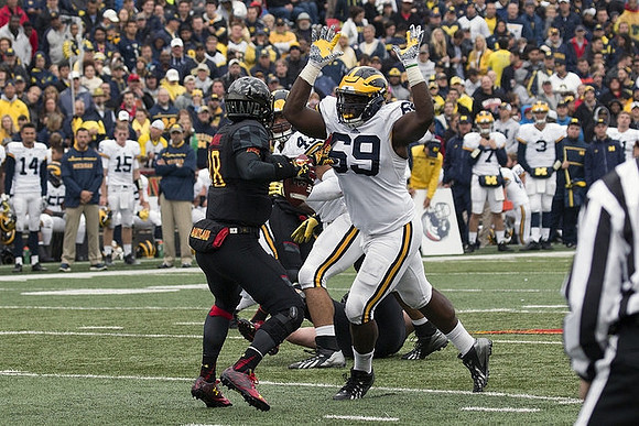 Willie Henry (69) and Chris Wormley (43)