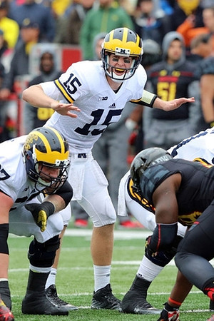 Kyle Kalis (67) and Jake Rudock (15)