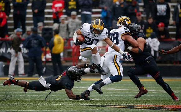 Drake Johnson (20) and Jake Butt (88)