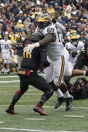 Willie Henry (69) and Jabrill Peppers (5)