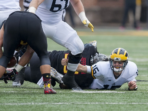 Kyle Kalis (67) and Jake Rudock (15)
