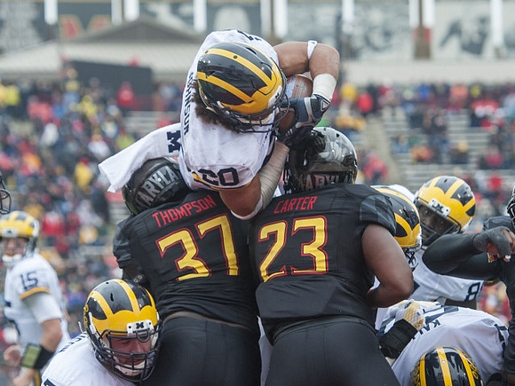 Drake Johnson (20), Erik Magnuson (78), Kyle Kalis (67), and Jake Rudock (15)