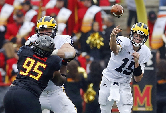 Graham Glasgow (61) and Jake Rudock (15)