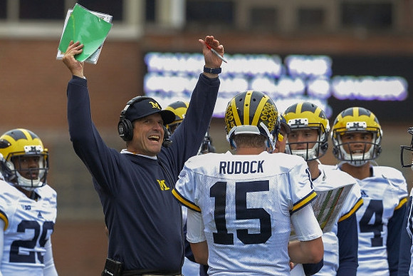 Dymonte Thomas (25), Jim Harbaugh, and Jake Rudock (15)