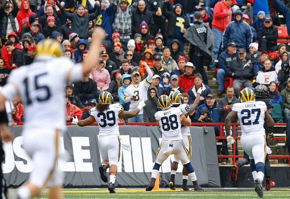 Jake Rudock (15), Sione Houma (39), Jake Butt (88), and Derrick Green (27)