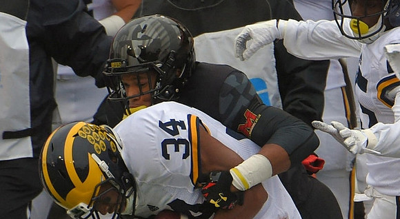 Jeremy Clark (34) and Jabrill Peppers (5)