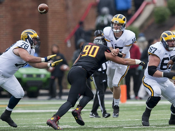 Erik Magnuson (78), Jake Rudock (15), and Kyle Kalis (67)